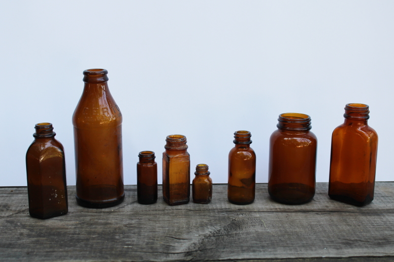 photo of vintage & antique root beer brown glass bottles, lot of old amber glass medicine bottles  #1