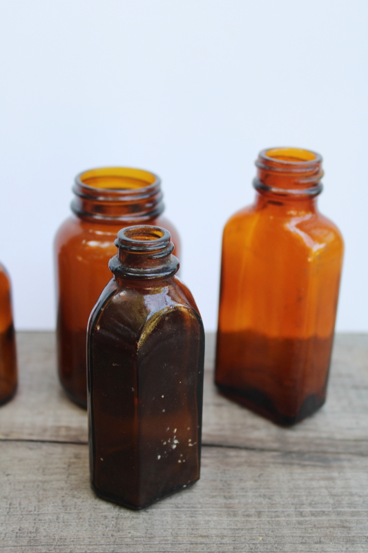 photo of vintage & antique root beer brown glass bottles, lot of old amber glass medicine bottles #3