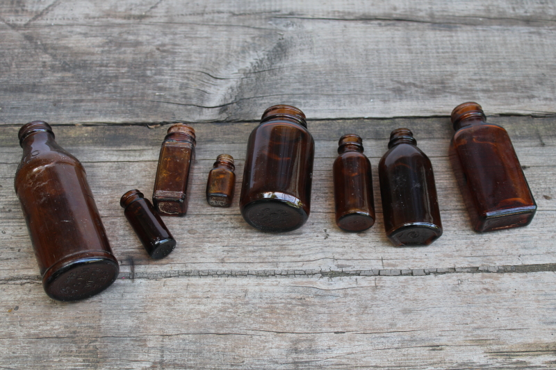 photo of vintage & antique root beer brown glass bottles, lot of old amber glass medicine bottles #5