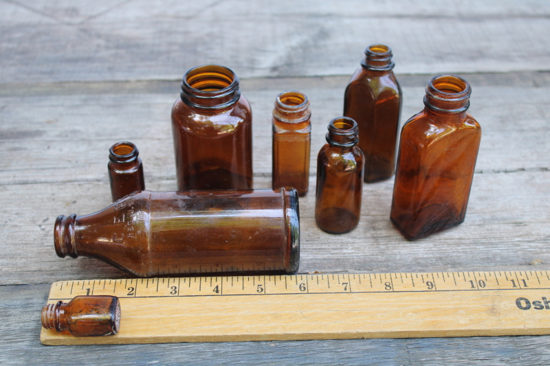 photo of vintage & antique root beer brown glass bottles, lot of old amber glass medicine bottles #6