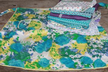 catalog photo of vintage apron lot, kitchen aprons all retro fabric, pretty prints in aqua blue, lavender purple 