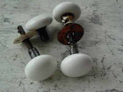 photo of vintage architectural doorknobs, white porcelain #1