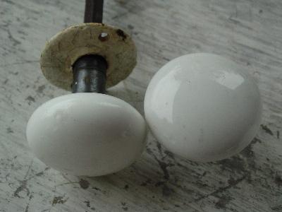 photo of vintage architectural doorknobs, white porcelain #3