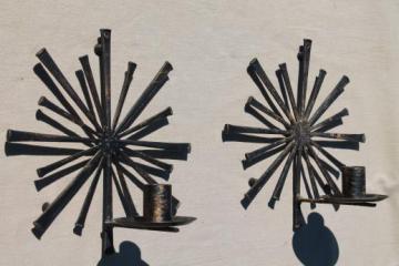 catalog photo of vintage atomic starburst wall sconces, rustic mod metal horseshoe nail candle holders