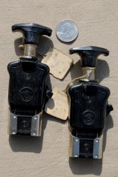 catalog photo of vintage bakelite electric plugs for restoration, new old stock w/ original hang tags 