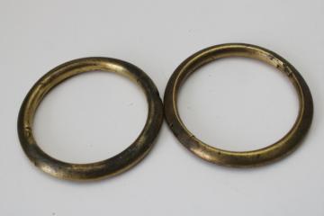 catalog photo of vintage brass bull rings, smaller size heavy solid brass rings w/ tarnished patina 