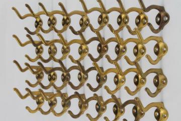 catalog photo of vintage brass double coat hooks, lot of 33 brass plated wall hooks for coat rack