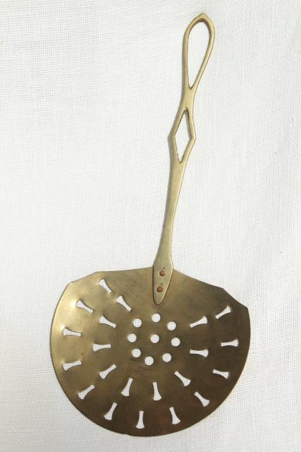 photo of vintage brass skimmer, long handle strainer spoon, fireplace hearth or kitchen tool #1