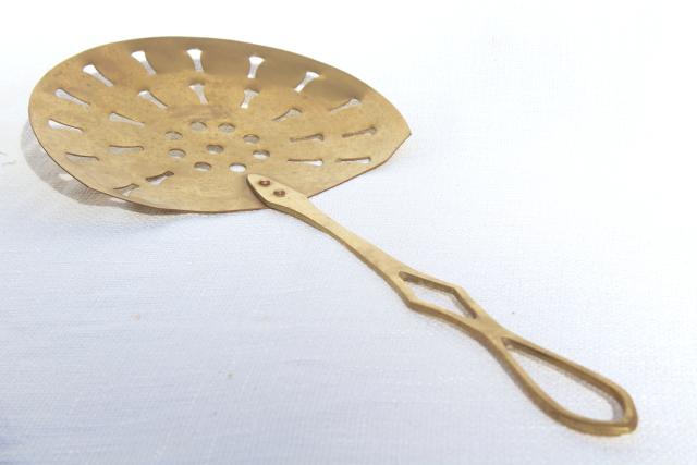 photo of vintage brass skimmer, long handle strainer spoon, fireplace hearth or kitchen tool #6