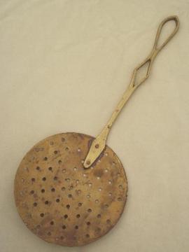 catalog photo of vintage brass strainer paddle, large flat sieve spoon w/ long handle