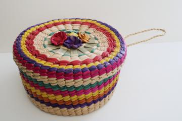 catalog photo of vintage bright colored woven straw sewing basket, round hat box shape