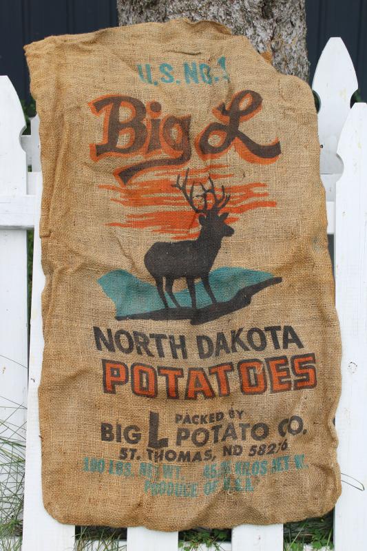 photo of vintage burlap bag potato sacks w/ print graphics Big L buck deer silhouette #1