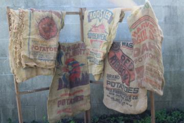 catalog photo of vintage burlap bags, lot of old potato sacks w/ printed advertising graphics