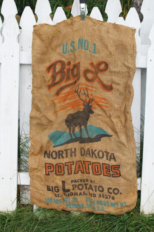 photo of vintage burlap bags, old potato sacks w/ print graphics Big L buck deer silhouette #2