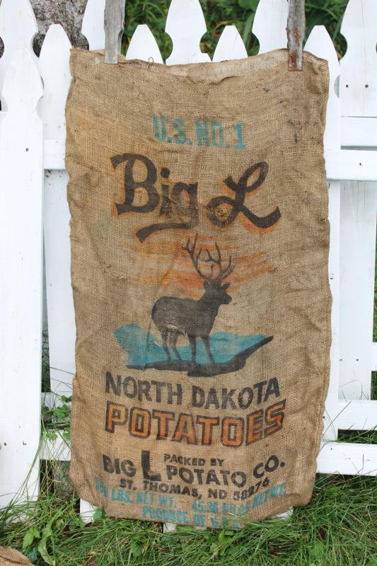 photo of vintage burlap bags, old potato sacks w/ print graphics Big L buck deer silhouette #3