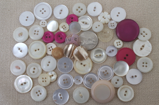 photo of vintage buttons collection, old glass barrel jar full of buttons of all kinds #8