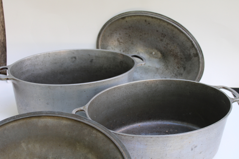photo of vintage cast aluminum oval dutch ovens or roasters, lot of two roasting pans w/ lids  #14