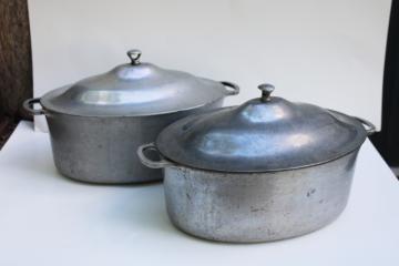 catalog photo of vintage cast aluminum oval dutch ovens or roasters, lot of two roasting pans w/ lids 