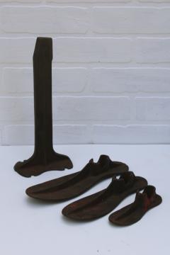 catalog photo of vintage cast iron cobbler's anvil, shoe last set foot shape molds w/ tall stand 