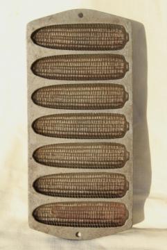 catalog photo of vintage cast iron cookware, ears of corn cornbread pan for baking corn sticks