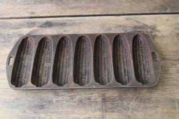 catalog photo of vintage cast iron cornbread pan for corn stick muffins, ears of corn mold