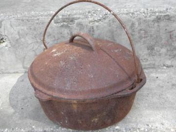 catalog photo of vintage cast iron dutch oven & lid for wood stove/campfire cooking