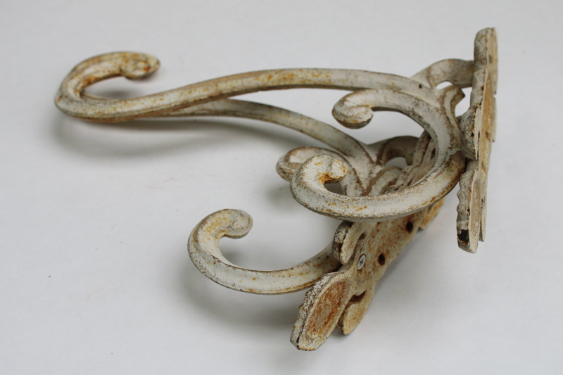photo of vintage cast iron hooks, large ornate wall mount plant hangers or coat hooks w/ old white paint  #9