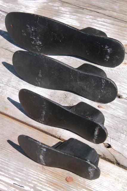 photo of vintage cast iron shoe last set w/ metal foot shape stretchers, feet in all sizes #7