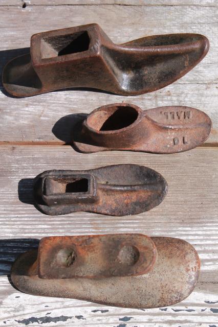 photo of vintage cast iron shoe last set w/ metal foot shape stretchers, feet in all sizes #11