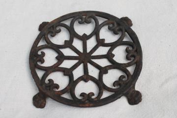 catalog photo of vintage cast iron trivet, tea kettle trivet w/ paw foot design John Wright antique reproduction 
