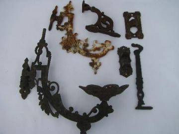 catalog photo of vintage cast iron wall sconce brackets & arms, antique oil lamp holders