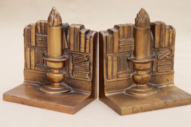 photo of vintage cast metal bookends w/ antique brass finish, book & candle stick stacks of books #1