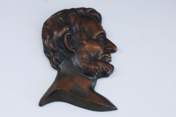 catalog photo of vintage cast metal bronze bust of Lincoln, profile relief coin art portrait