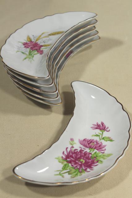 photo of vintage china bone dishes w/ different floral patterns, crescent shaped side plates #1