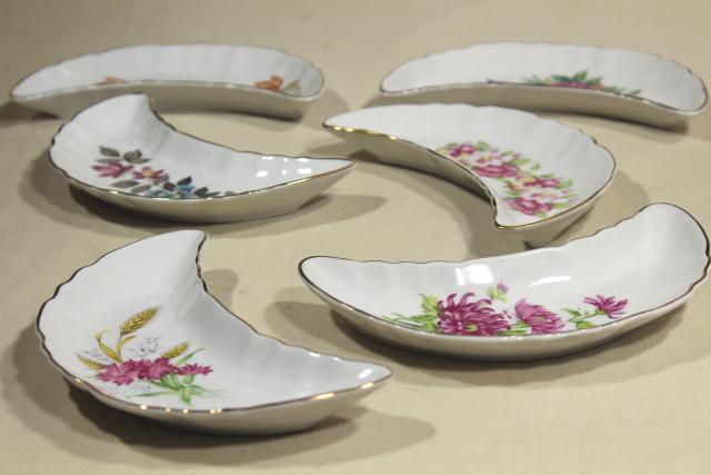 photo of vintage china bone dishes w/ different floral patterns, crescent shaped side plates #2