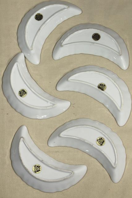 photo of vintage china bone dishes w/ different floral patterns, crescent shaped side plates #3