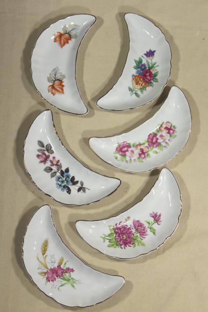 photo of vintage china bone dishes w/ different floral patterns, crescent shaped side plates #5