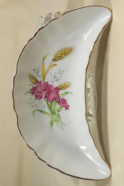 photo of vintage china bone dishes w/ different floral patterns, crescent shaped side plates #7