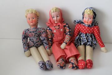 catalog photo of vintage cloth dolls, girls w/ blonde braids in Polish folk costumes, cotton print skirt, headscarf & overalls 