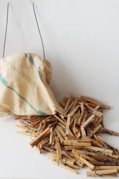 catalog photo of vintage clothespin bag full of old wood clothespins, wire hanger for laundry wash line