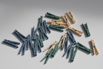 catalog photo of vintage clothespins lot, country blue, green, cream plastic, retro laundry room decor