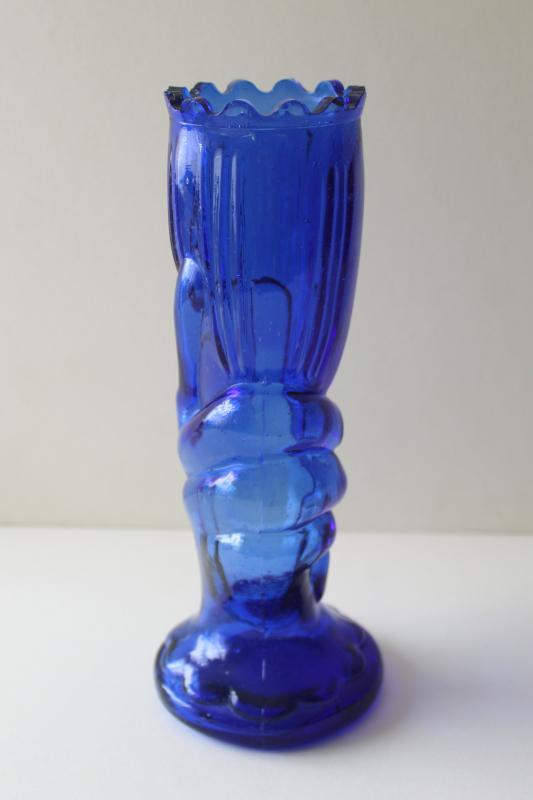 photo of vintage cobalt blue glass vase, lady's hand holding trumpet shaped flower #3