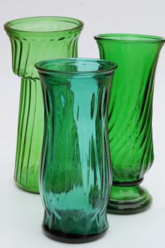 catalog photo of vintage collection of swirl glass flower vases in greens, teal, forest green, lime