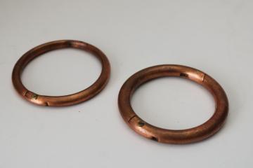 catalog photo of vintage copper bull rings, heavy solid copper rings w/ tarnished patina 