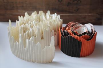 catalog photo of vintage corrugated paper shelf edging for holiday displays, winter white Christmas icicles, orange & black Halloween 