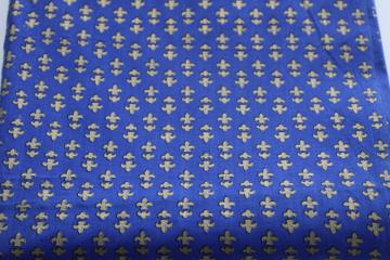 catalog photo of vintage cotton fabric, royal blue w/ metallic gold French fleur de lis print