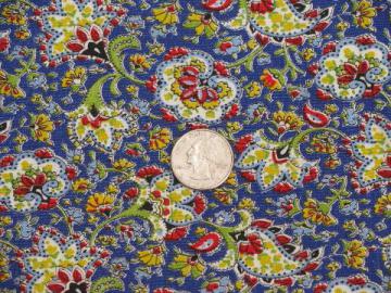 catalog photo of vintage cotton fabric, small paisley floral print, brights on deep blue