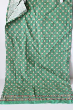 catalog photo of vintage cotton feed sack fabric, border print on green hemmed kitchen towel 