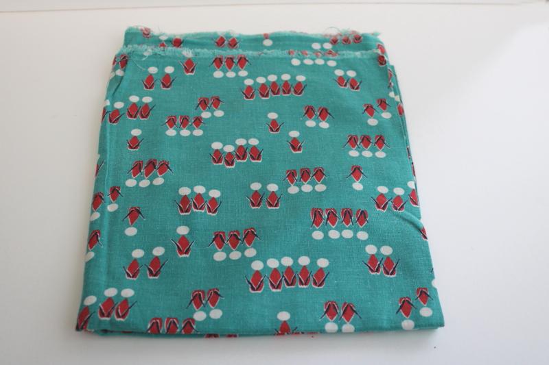 photo of vintage cotton feedsack fabric, abstract people print jade green w/ red & white #1