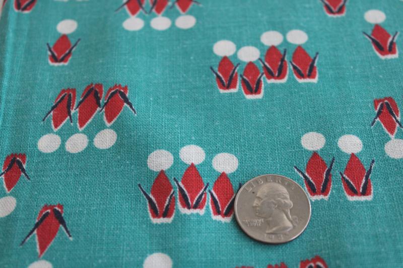 photo of vintage cotton feedsack fabric, abstract people print jade green w/ red & white #2